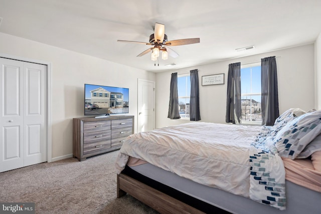 carpeted bedroom featuring ceiling fan