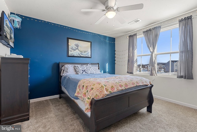 bedroom with ceiling fan and carpet flooring