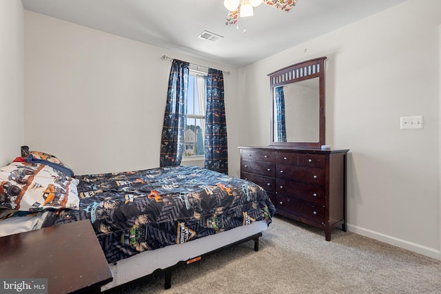 bedroom featuring light carpet and ceiling fan