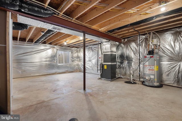 basement featuring heating unit and gas water heater