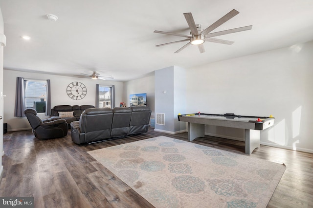 living room with ceiling fan and hardwood / wood-style floors