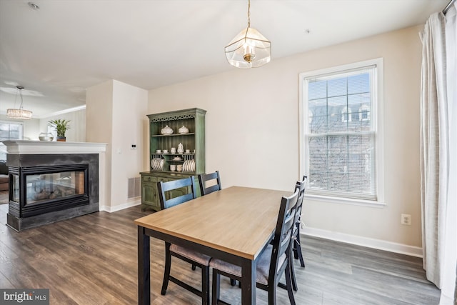 dining room with dark wood-type flooring