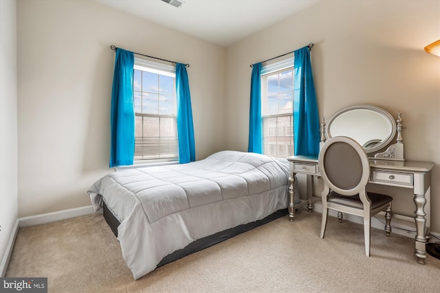 bedroom with light colored carpet