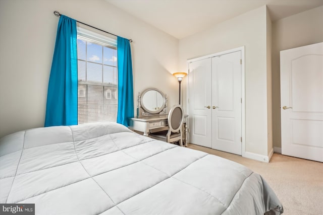 carpeted bedroom featuring a closet