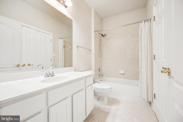 full bathroom featuring toilet, vanity, tile patterned floors, and shower / bath combo with shower curtain