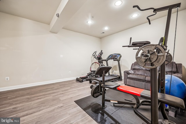 workout area with wood-type flooring