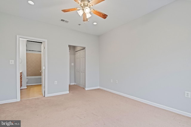 unfurnished bedroom with light carpet, ceiling fan, and a closet