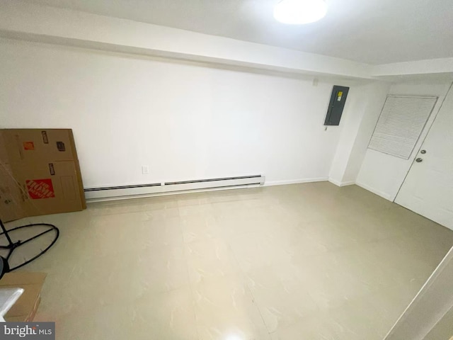 basement featuring a baseboard heating unit and electric panel