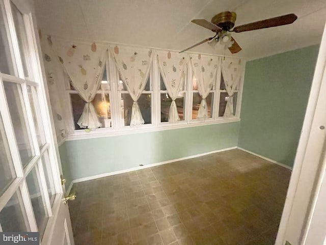 unfurnished room featuring ceiling fan