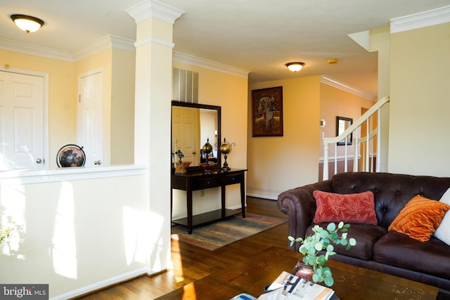 living room with crown molding, dark wood finished floors, and ornate columns