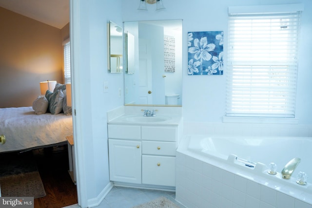 full bath with vanity, a bath, and tile patterned floors