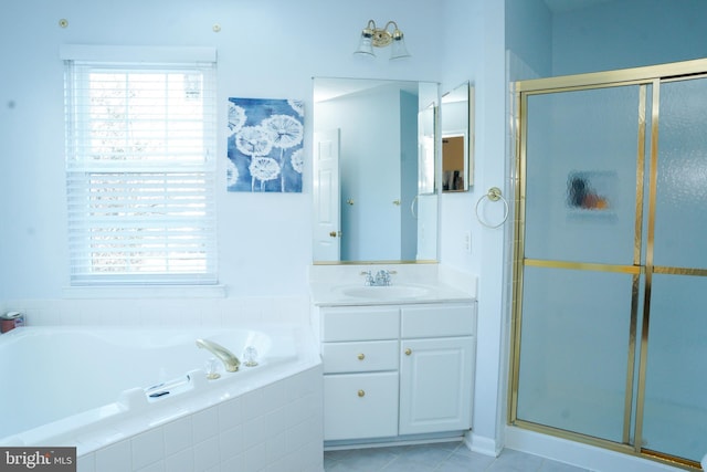 full bath with tile patterned flooring, a garden tub, a shower stall, and vanity