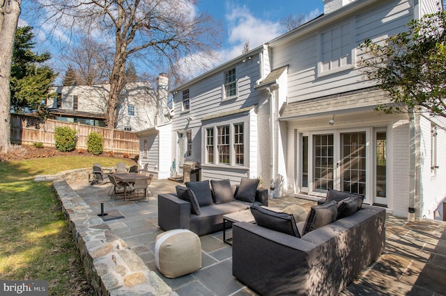 view of patio featuring area for grilling, french doors, outdoor lounge area, and fence