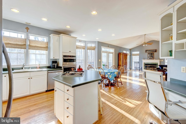 kitchen featuring white cabinetry, sink, a wealth of natural light, and appliances with stainless steel finishes