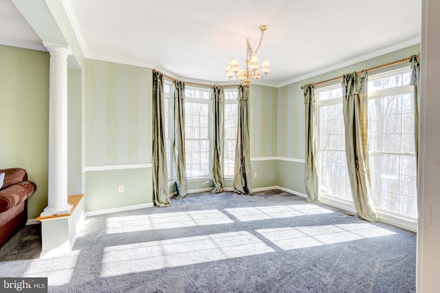 unfurnished room with ornate columns, ornamental molding, light colored carpet, and a chandelier