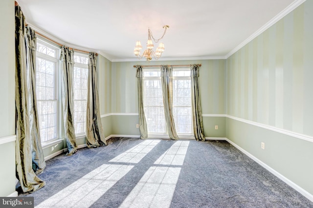 spare room with ornamental molding, a wealth of natural light, and a notable chandelier