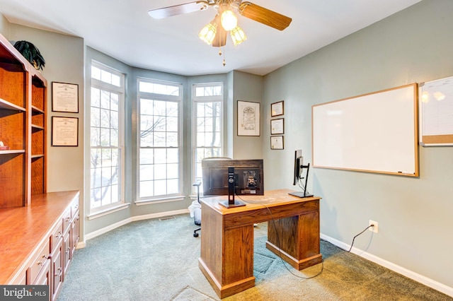 office featuring plenty of natural light, light colored carpet, and ceiling fan