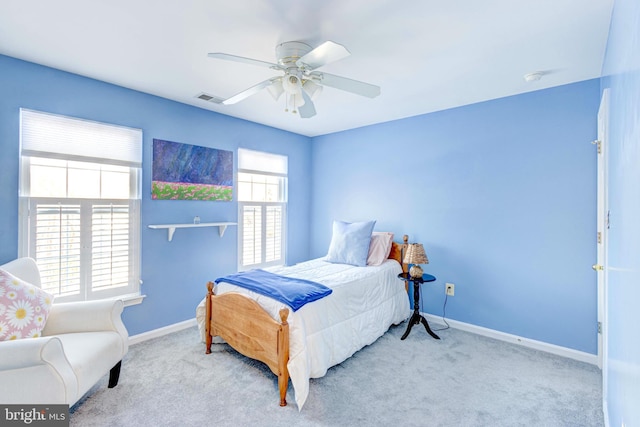 bedroom with light colored carpet and ceiling fan