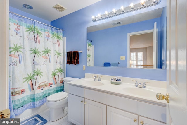 bathroom featuring a shower with shower curtain, vanity, toilet, and tile patterned flooring