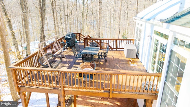 view of snow covered deck