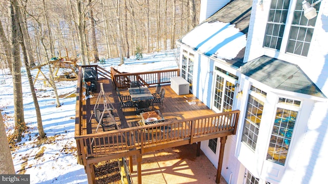 view of snow covered deck