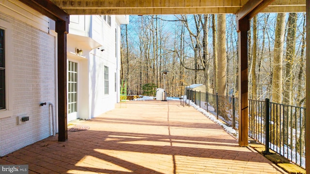 wooden terrace with a patio