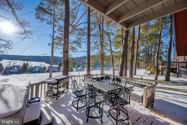 view of snow covered deck