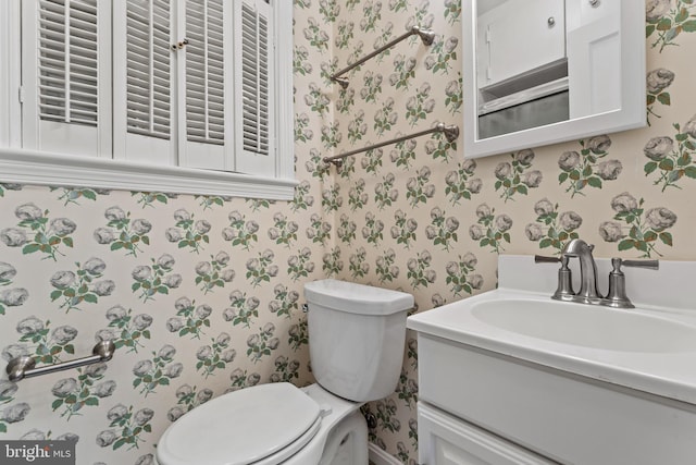 bathroom featuring vanity and toilet