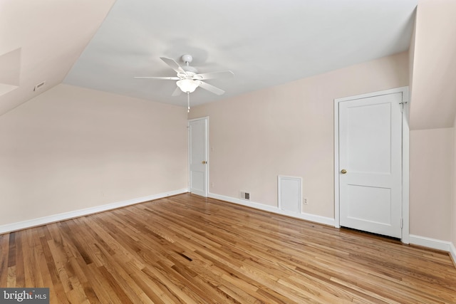 bonus room with ceiling fan, lofted ceiling, and light hardwood / wood-style floors