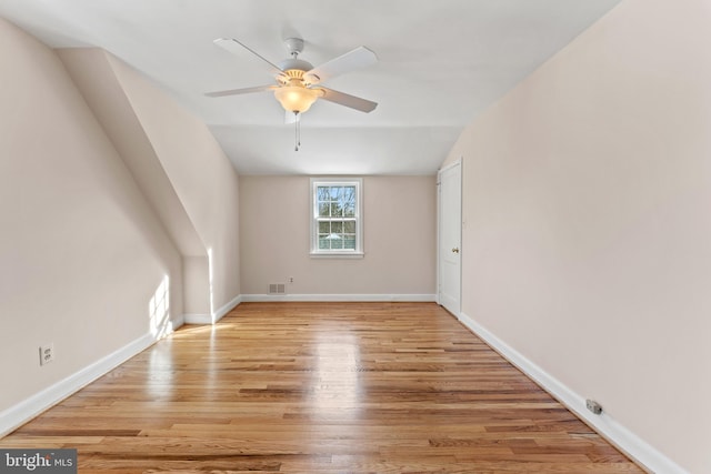 interior space featuring vaulted ceiling, ceiling fan, and light wood-type flooring