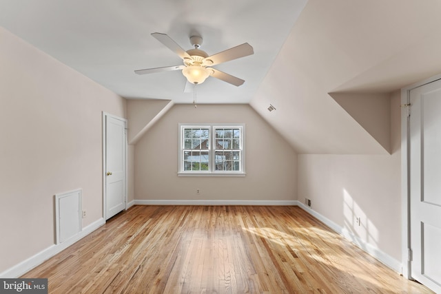 additional living space featuring lofted ceiling, light hardwood / wood-style flooring, and ceiling fan