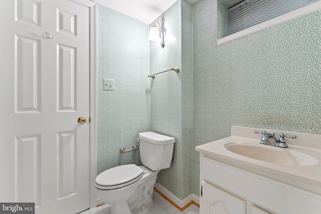 bathroom with vanity, tile patterned floors, and toilet