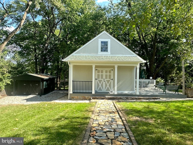 view of outdoor structure with a lawn