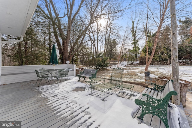 view of snow covered deck