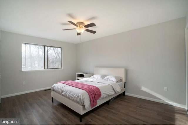 bedroom with dark wood-type flooring and ceiling fan