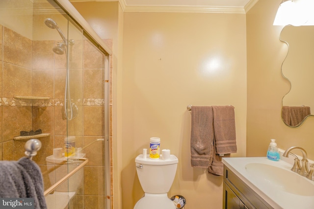 bathroom with toilet, walk in shower, crown molding, and vanity