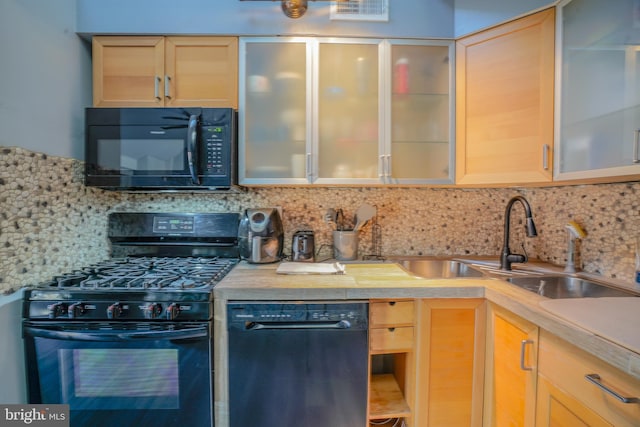 kitchen featuring black appliances, sink, light brown cabinets, and tasteful backsplash