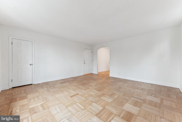 unfurnished room featuring light parquet floors