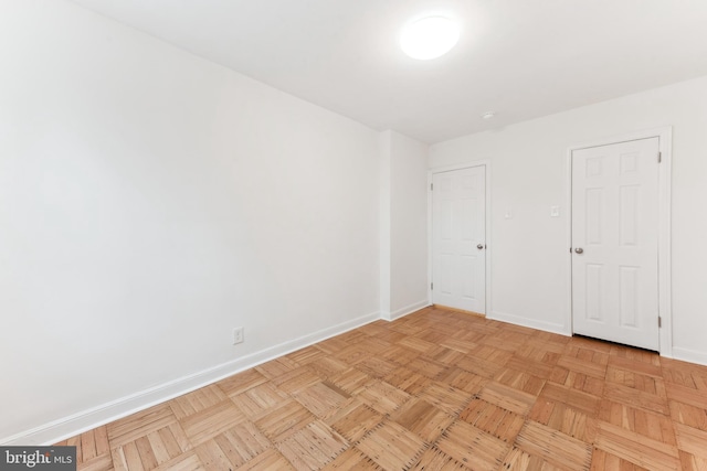 unfurnished bedroom with light parquet floors