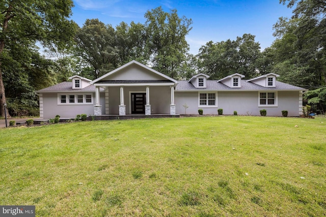 ranch-style house with a front lawn and a porch