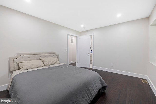 bedroom featuring dark hardwood / wood-style flooring