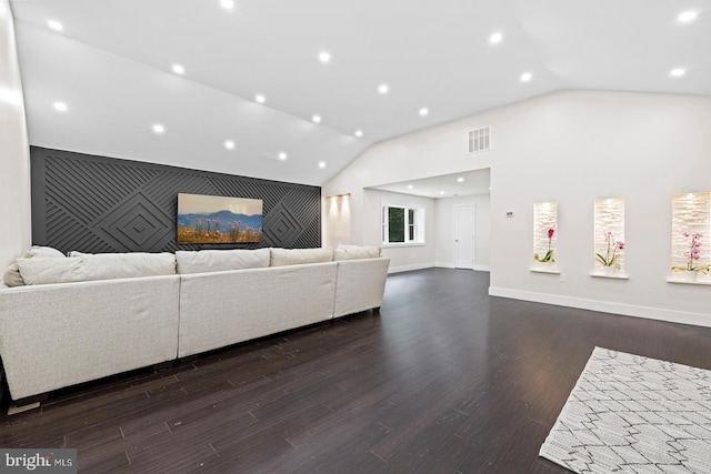 living room with vaulted ceiling and dark hardwood / wood-style flooring