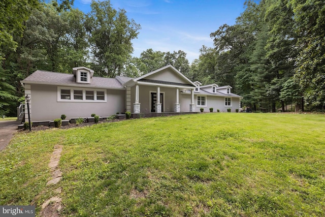 view of front of home with a front lawn and a porch