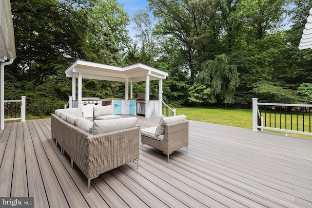 deck with a lawn, an outdoor hangout area, and a grill