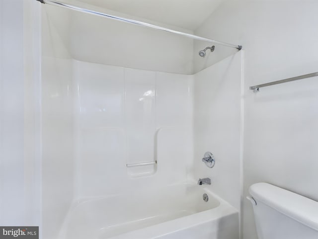 bathroom with toilet and  shower combination