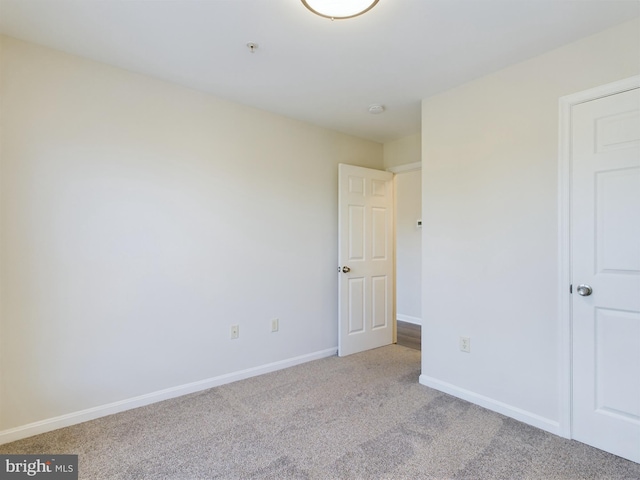 empty room with light colored carpet