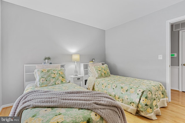 bedroom featuring hardwood / wood-style flooring