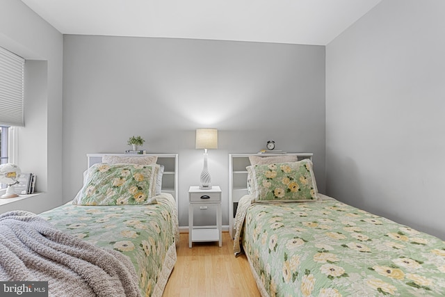 bedroom with light wood-type flooring