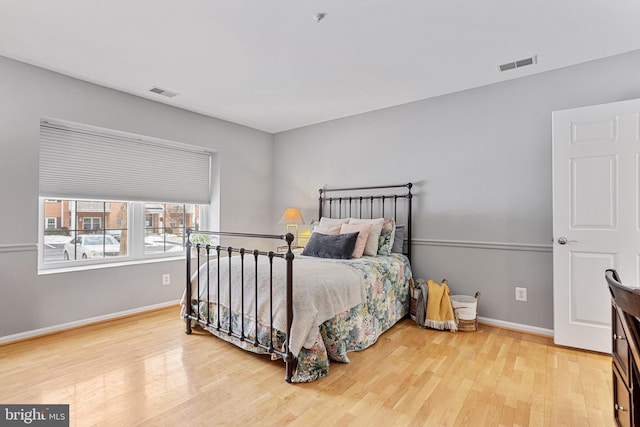 bedroom with wood-type flooring