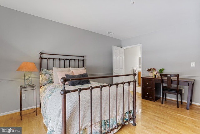 bedroom with light hardwood / wood-style flooring